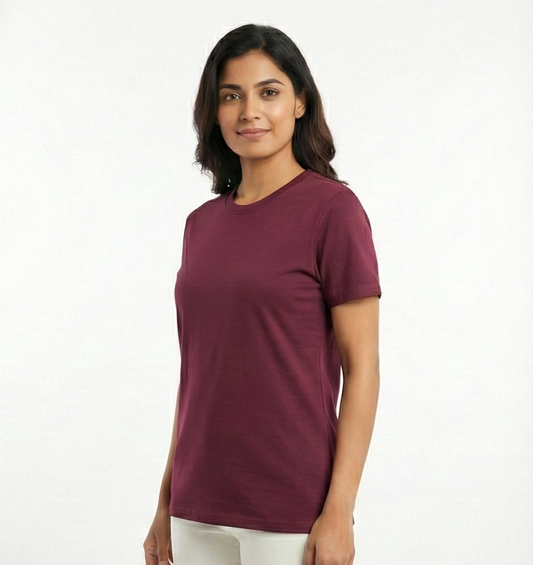 Woman wearing a maroon t-shirt on a white background