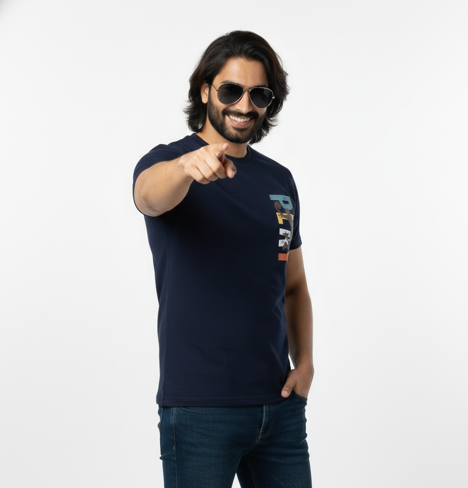 Man wearing a navy blue t-shirt with colorful text design on a white background