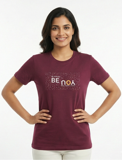 Woman wearing a maroon t-shirt with text on a white background