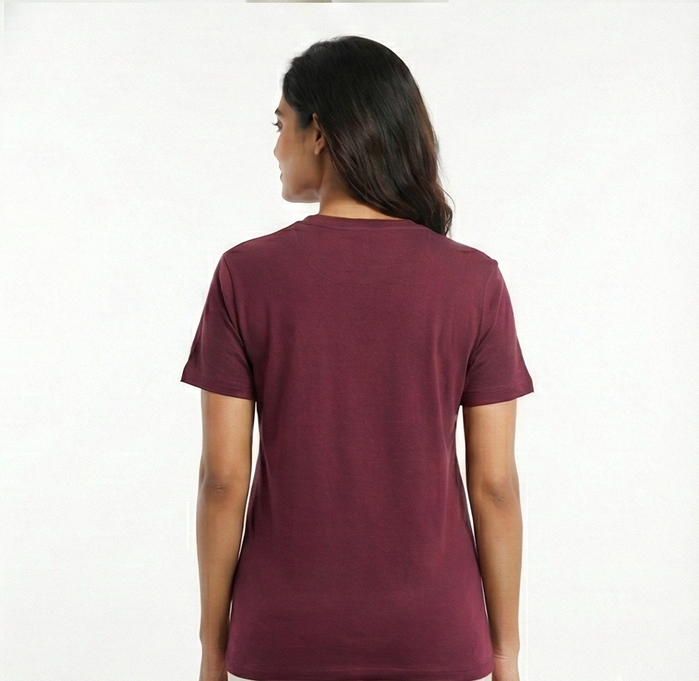 Person wearing a maroon t-shirt on a white background
