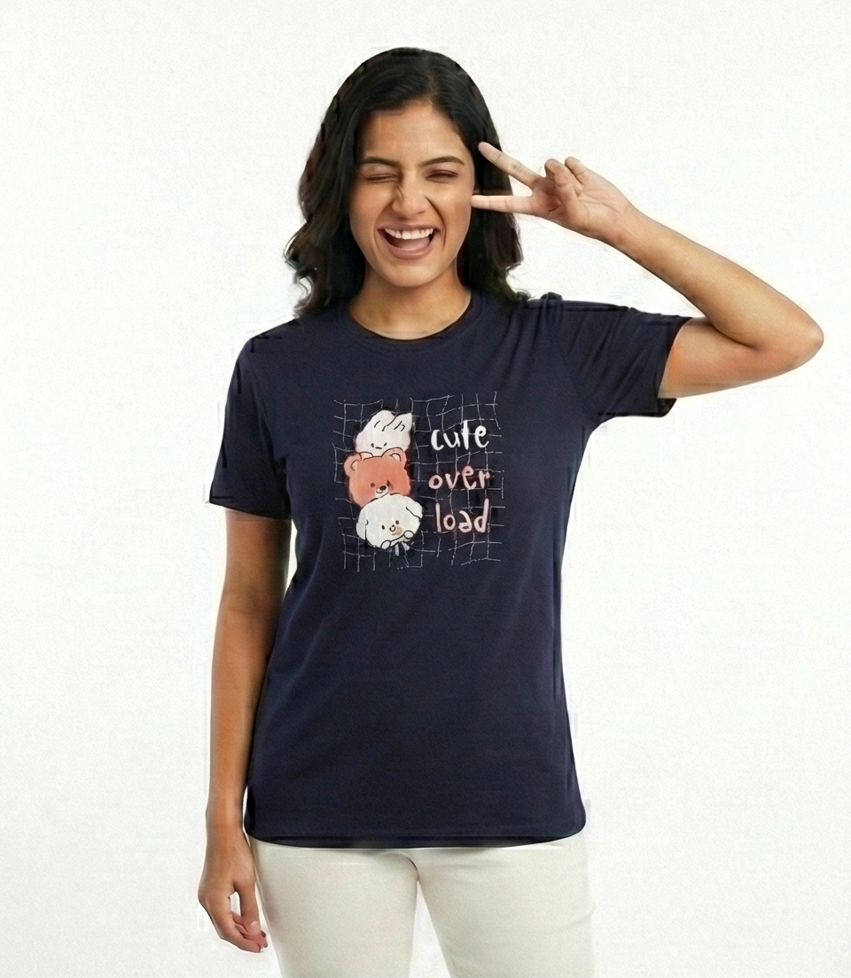 Woman wearing a navy blue t-shirt with a graphic design and text, making a peace sign.