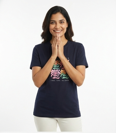 Woman wearing a navy blue t-shirt with a colorful graphic design on a white background